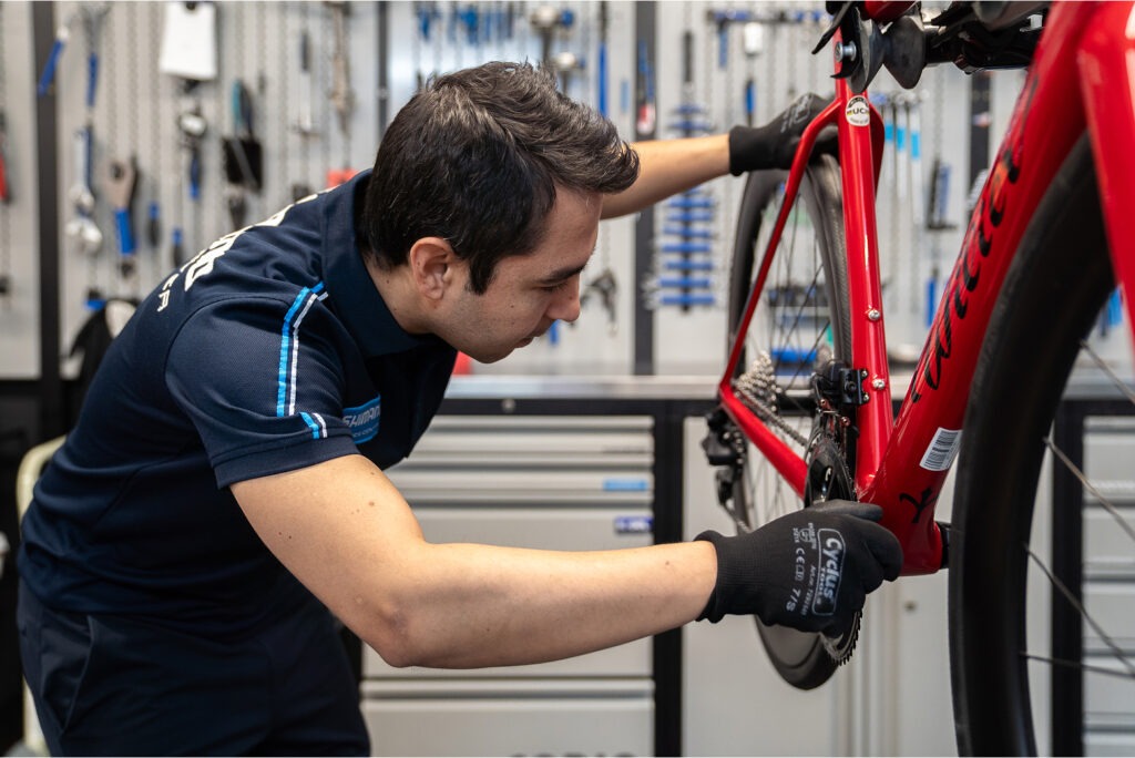 Photo of Cyclovia team repairing a bike